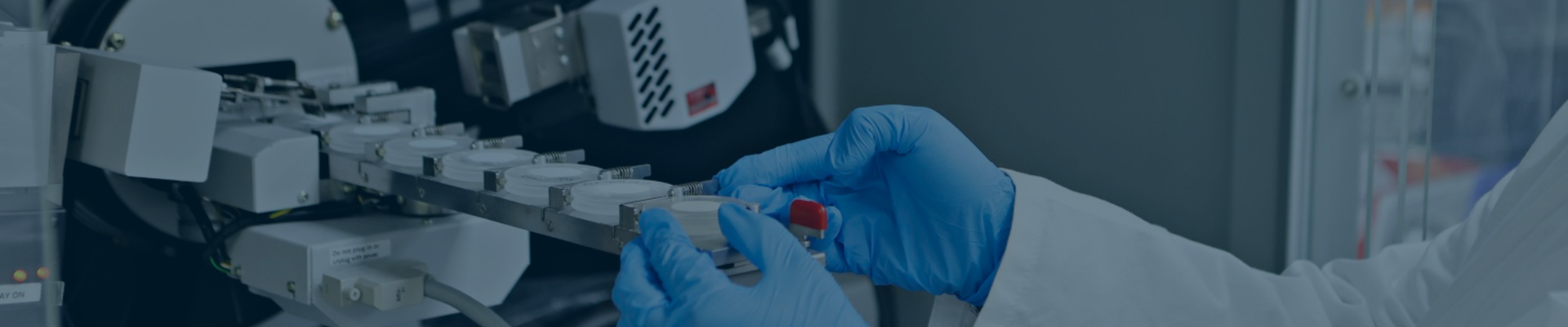 Scientist operating X-ray diffraction equipment for solid-state analysis in a GMP laboratory