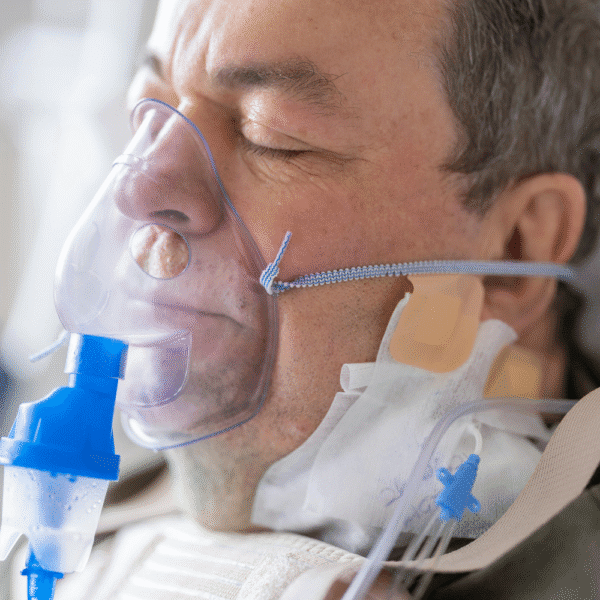 man using nebulizer respiratory device