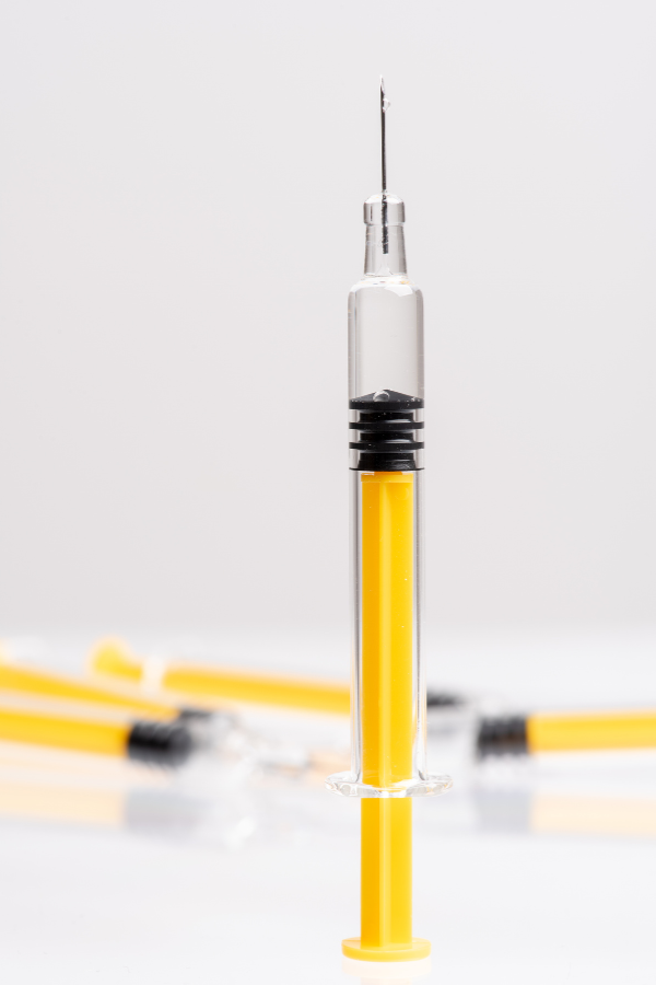 Close-up of a finished prefilled syringe used for pharmaceutical and medical device performance testing.
