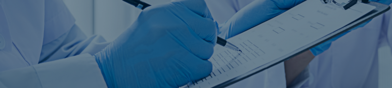 Gloved laboratory professional completing a compliance checklist on a clipboard.